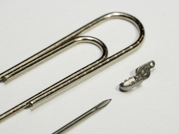 Clevis beside a paper clip